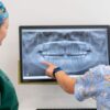 Genesis Dental staff looking at dental x-rays