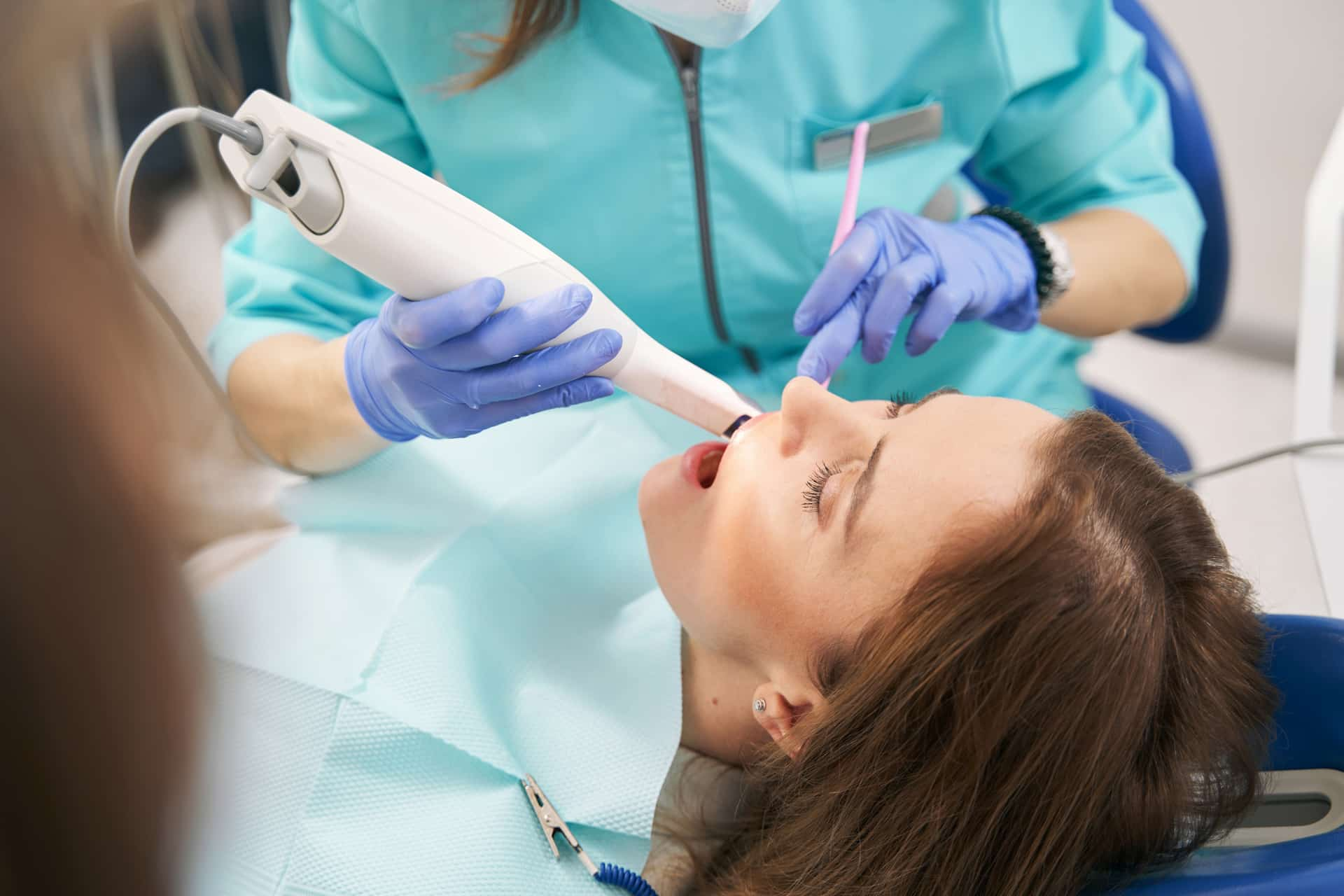 Patient with scanner in mouth showing what is digital smile design